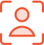 Ein orangefarbenes Symbol mit der Silhouette einer Person in der Mitte eines rechteckigen Rahmens mit abgerundeten Ecken. Der Rahmen hat auf jeder Seite kleine quadratische Details, die auf ein Fokus- oder Aufnahmesymbol hindeuten. Der Hintergrund ist durchgehend weiß.